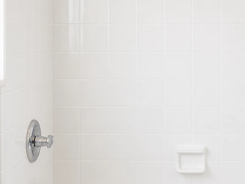 The same Glenview tub-surround tile after reglazing, bright white with sealed grout